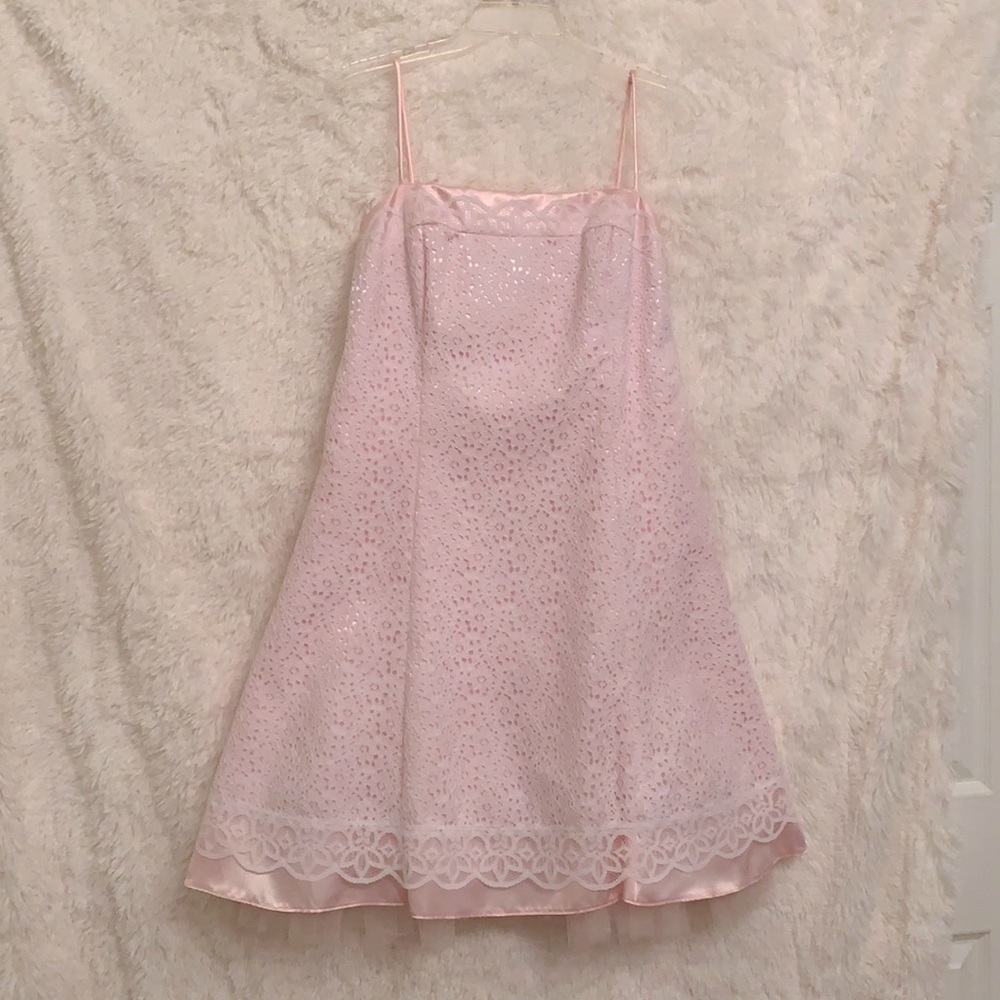 A-line pink dress with white lace overlay.